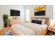 Serene bedroom featuring wood floors, modern art, and neutral decor at 5352 Beaver Br, Norcross, GA 30071