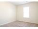 Clean, bright bedroom showcasing neutral carpet and a window at 5352 Beaver Br, Norcross, GA 30071
