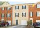 Two-story townhome with a garage and green shutters in a residential neighborhood at 5352 Beaver Br, Norcross, GA 30071