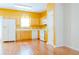 Bright kitchen with wood cabinets and white appliances, ample counter space and hardwood floors at 5352 Beaver Br, Norcross, GA 30071