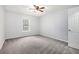 Bedroom with neutral carpeting and a double-door closet at 1510 Gettysburg Pl, Atlanta, GA 30350
