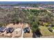 An aerial view of the home showcasing the surrounding area filled with dense trees and a long private driveway at 3057 Bold Springs Rd, Dacula, GA 30019