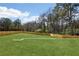 Huge backyard featuring a wooden fence for privacy and lots of space for recreation at 3057 Bold Springs Rd, Dacula, GA 30019