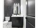 Half bathroom featuring a modern vanity, white marble floors, and a dark accent wall at 3057 Bold Springs Rd, Dacula, GA 30019