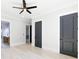 Spacious bedroom with light hardwood floors and access to the ensuite bathroom at 3057 Bold Springs Rd, Dacula, GA 30019