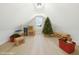 Bonus room featuring holiday decorations and hardwood floors at 3057 Bold Springs Rd, Dacula, GA 30019