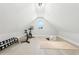 Bonus room featuring a stationary bike, weights, a pilates mat, and hardwood floors at 3057 Bold Springs Rd, Dacula, GA 30019