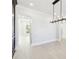 Hallway showcasing light wood flooring, white walls, and modern lighting fixtures at 3057 Bold Springs Rd, Dacula, GA 30019
