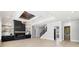 Spacious living room showcasing fireplace, chandelier, staircase, and doorway at 3057 Bold Springs Rd, Dacula, GA 30019