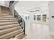 Bright living room boasts a decorative ceiling, contemporary chandelier, and plentiful natural light from large windows at 3057 Bold Springs Rd, Dacula, GA 30019