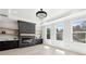 Spacious living room featuring an electric fireplace with custom shelves and bright natural light from large windows at 3057 Bold Springs Rd, Dacula, GA 30019