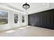 The living room features black decorative trim and plentiful natural light from large windows at 3057 Bold Springs Rd, Dacula, GA 30019