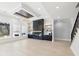 Open living room features a modern fireplace, built-in shelves, and large windows for natural light at 3057 Bold Springs Rd, Dacula, GA 30019