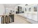 Open-concept living room with a fireplace, lots of windows, and light hardwood floors at 3057 Bold Springs Rd, Dacula, GA 30019