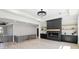 The living room features a modern fireplace, custom shelves, and open access to other rooms at 3057 Bold Springs Rd, Dacula, GA 30019