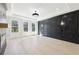 Luxurious main bedroom featuring elegant lighting, hardwood floors and bright windows at 3057 Bold Springs Rd, Dacula, GA 30019