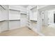 Spacious walk-in closet with custom shelving at 3057 Bold Springs Rd, Dacula, GA 30019
