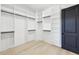Walk-in closet with custom shelving and storage, providing ample space for organizing your wardrobe at 3057 Bold Springs Rd, Dacula, GA 30019