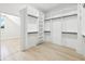 Walk-in closet with custom shelving and storage offering ample space for organizing your wardrobe at 3057 Bold Springs Rd, Dacula, GA 30019