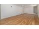 Open basement with hardwood floors, ready to be customized for a variety of uses at 546 Milligan Dr, Stone Mountain, GA 30083