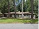 Charming single-story home with a well-maintained lawn, stone walkway, and a bright blue front door at 546 Milligan Dr, Stone Mountain, GA 30083