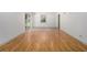 Spacious and bright living room with hardwood flooring and access to the backyard at 546 Milligan Dr, Stone Mountain, GA 30083