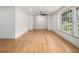 Spacious living room with hardwood floors, large windows offering natural light, and ample space at 546 Milligan Dr, Stone Mountain, GA 30083