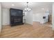 Open living room featuring hardwood floors and a brick fireplace at 546 Milligan Dr, Stone Mountain, GA 30083