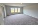 Carpeted bedroom featuring three windows at 660 Redhead Way (Lot 24), Grayson, GA 30017