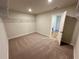 Spacious walk-in closet featuring neutral carpeting and ample shelving for optimal storage solutions at 660 Redhead Way (Lot 24), Grayson, GA 30017