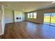 Spacious living room with hardwood floors, large windows, and a modern fireplace at 660 Redhead Way (Lot 24), Grayson, GA 30017