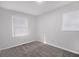 Bedroom featuring neutral carpet and white walls, creating a calm and serene space at 7437 Nulan Way, Riverdale, GA 30274