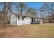 Charming one-story home with black shutters, black trim, and a fenced yard, offering curb appeal at 7437 Nulan Way, Riverdale, GA 30274