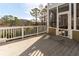 Expansive deck offering outdoor living with great views, featuring white railings and access to a screened porch at 764 Sharpshooters Nw Rdg, Marietta, GA 30064
