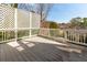 A spacious wooden deck area with a white lattice screen, offering privacy and outdoor living at 764 Sharpshooters Nw Rdg, Marietta, GA 30064