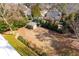 View of the backyard with a small shed, trees, and the house in the background at 764 Sharpshooters Nw Rdg, Marietta, GA 30064