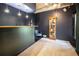 Finished basement bar with custom lighting, display case, and blue accent chair at 764 Sharpshooters Nw Rdg, Marietta, GA 30064