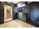 Finished basement bar with custom lighting, bar table, and access to stairs at 764 Sharpshooters Nw Rdg, Marietta, GA 30064