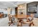 Finished basement with a stone fireplace, large dark flatscreen and a game table with seating at 764 Sharpshooters Nw Rdg, Marietta, GA 30064