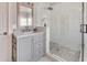 Well-lit bathroom featuring a glass shower and gray vanity with marble countertop at 764 Sharpshooters Nw Rdg, Marietta, GA 30064