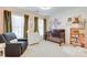 Bedroom features a comfortable recliner, crib, and decorated wall at 764 Sharpshooters Nw Rdg, Marietta, GA 30064