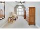 Light-filled sitting area in bedroom with a side chair, table, and two dressers at 764 Sharpshooters Nw Rdg, Marietta, GA 30064