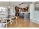 Dining area open to the kitchen, with hardwood floors and stairs nearby at 764 Sharpshooters Nw Rdg, Marietta, GA 30064