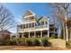Rear exterior view of the home showcasing the spacious two-story deck and manicured landscaping at 764 Sharpshooters Nw Rdg, Marietta, GA 30064