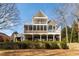Expansive rear exterior of home featuring a two-story deck with screening and columns at 764 Sharpshooters Nw Rdg, Marietta, GA 30064