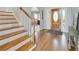 Open entryway featuring hardwood floors, a staircase and a view of the front door, creating a welcoming space at 764 Sharpshooters Nw Rdg, Marietta, GA 30064
