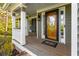Charming covered porch with white columns and a decorative front door, creating a warm welcome at 764 Sharpshooters Nw Rdg, Marietta, GA 30064