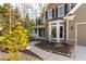 Inviting front yard with a charming stone walkway leading to a covered porch and front door at 764 Sharpshooters Nw Rdg, Marietta, GA 30064