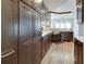A modern kitchen featuring stainless steel appliances, granite countertops, and dark cabinetry with an undermount sink at 764 Sharpshooters Nw Rdg, Marietta, GA 30064