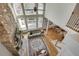 Bright and airy living room with hardwood floors, a stone fireplace, and floor-to-ceiling windows at 764 Sharpshooters Nw Rdg, Marietta, GA 30064
